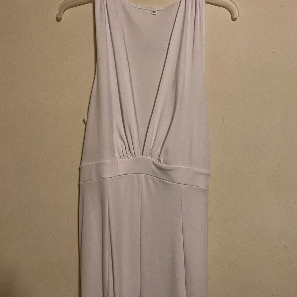 Elegant White jumpsuit with a sheer bell bottom leg, very comfortable and classy